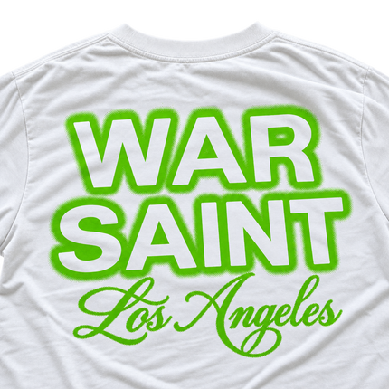 White cotton t-shirt featuring the Warsaint logo printed in neon green with a distressed halftone dot texture effect.
