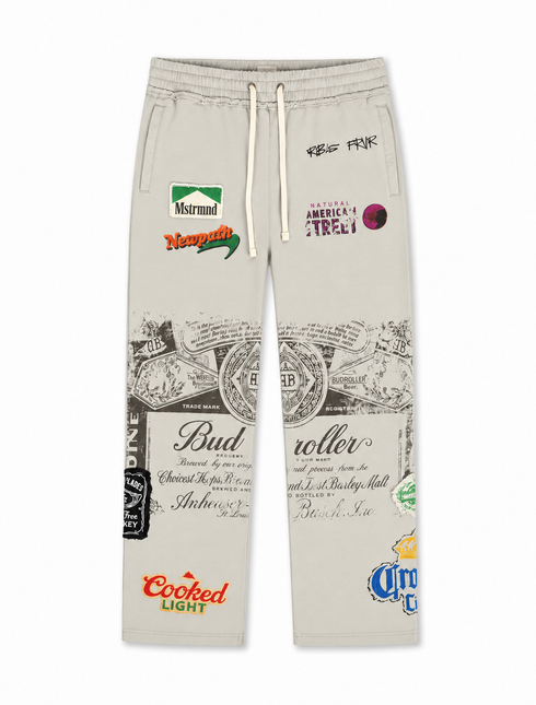 Rebel Minds grey cotton jogger pants featuring graphic patches, text overlays, and beer-inspired logos on both legs.