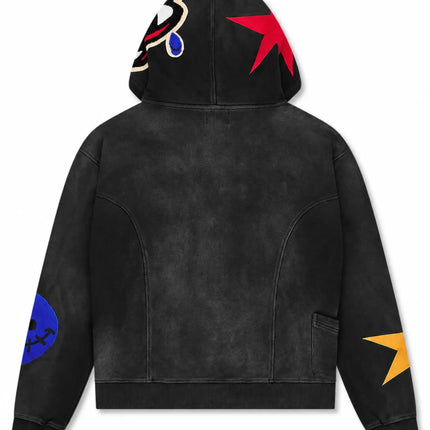 All Human black wash hoodie featuring a red star and cartoon patch on the hood, plus contrast sleeve appliqués.