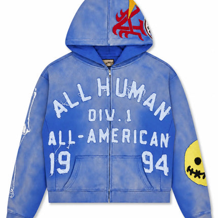 All Human El Perro V2 zip-up hoodie in blue acid wash cotton, featuring distressed white lettering and graphic patches.