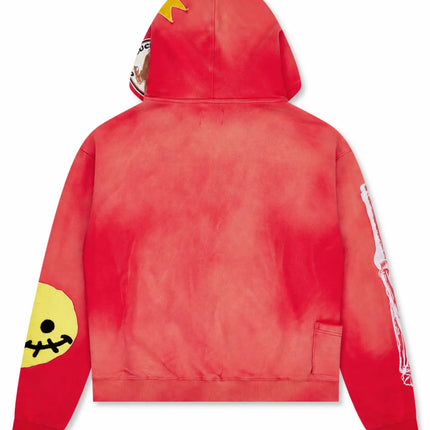 All Human 2+2=5 V2 hoodie in a vibrant red wash finish, featuring a yellow stitched smiley patch and skeleton arm detail.