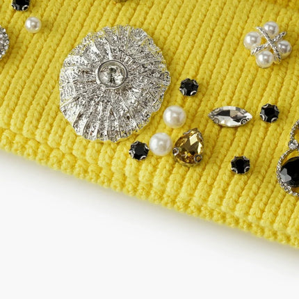 Valabasas yellow knit beanie embellished with an assortment of silver-toned metal, pearl, and colorful crystal studs.