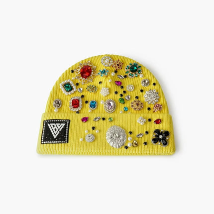 Bright yellow ribbed knit Valabasas beanie embellished with an array of colorful assorted rhinestones and gems.