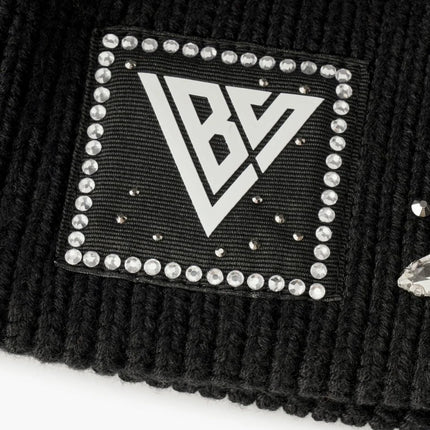 Black ribbed knit Valabasas beanie featuring a square patch with a white BV logo framed by sparkling rhinestones.