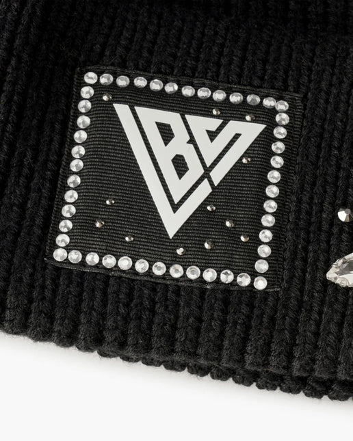 Black ribbed knit Valabasas beanie featuring a square patch with a white BV logo framed by sparkling rhinestones.