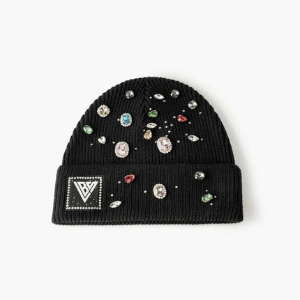 Valabasas black knit beanie featuring a ribbed texture, a branded logo patch, and multicolored gemstone embellishments.