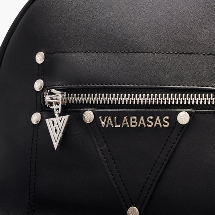 Black Valabasas La Borsa backpack featuring a silver brand logo, metallic zipper hardware, and a triangular patch.