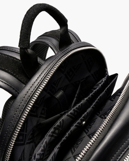 Valabasas La Borsa backpack featuring a black leather finish, metallic zipper hardware, and a branded interior lining.