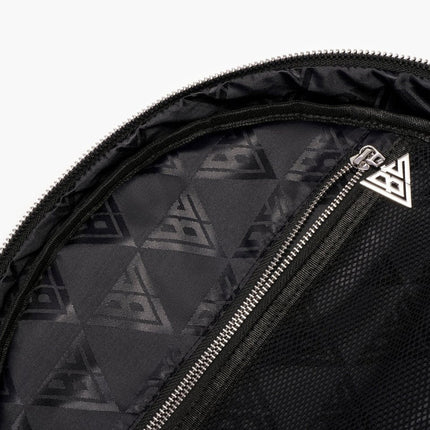 Close-up of a black Valabasas backpack interior featuring a repeating geometric logo pattern and a silver zipper.